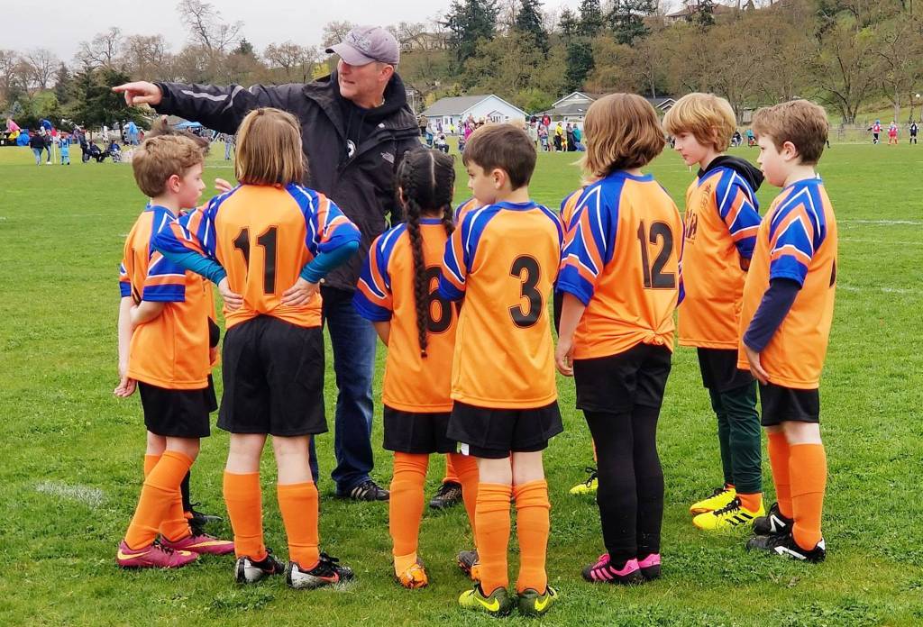 One of Sequim Junior Soccers coaches gives his players directions during a U-9 game at Haller Fields. Photos courtesy of David Henderson
