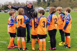 One of Sequim Junior Soccers coaches gives his players directions during a U-9 game at Haller Fields. Photos courtesy of David Henderson