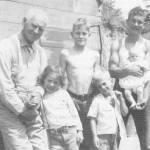 Sam Wyatt, left, with visiting girl (name unknown), Russell Wyatt, Frank Wyatt and Emery Hurley, holding Kay Wyatt. Photo courtesy Sequim Museum & Arts, Russell Wyatt