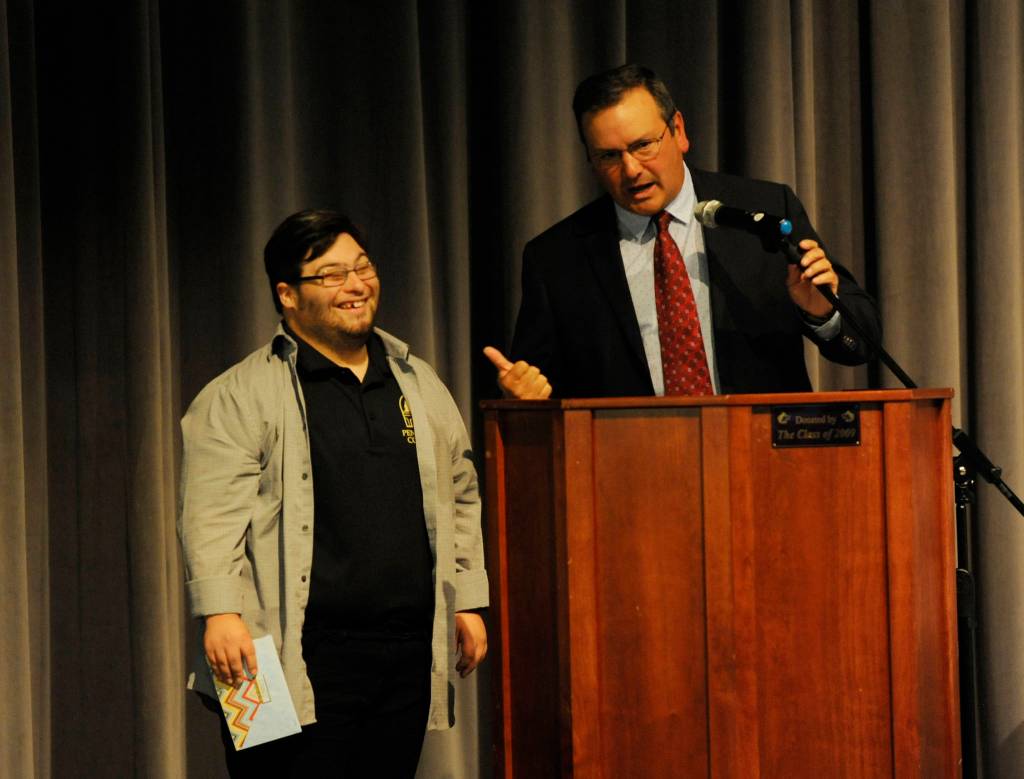 Sequim High School principal Shawn Langston, right, jokes with scholarship recipient Nicholas Barrett at last weeks Scholarship Awards assembly. Barrett received $3,000 in scholarships and plans to attend Peninsula College. Sequim Gazette photo by Michael Dashiell