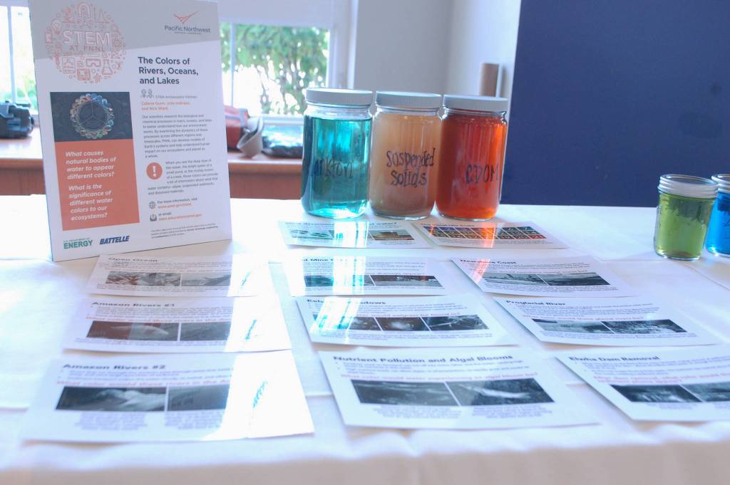 One of PNNLs science displays at the STEM Night event, this one detailing the causes of different water coloration, including what colors can indicate unsafe water to drink or be in. Sequim Gazette photo by Conor Dowley.