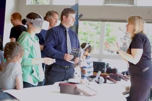 As students try out virtual reality devices, Sequim High School teacher Jorn Van de Weghe talks with Ann Wright-Mockler, Science & Engineering Education Consultant/Office of STEM Education for Pacific Northwest National Laboratory, at SHSs at the STEM Night event on May 28. Sequim Gazette photo by Conor Dowley