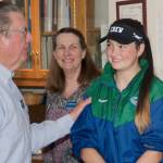 Sequim Bay Yacht Club members are helping Port Angeles rower Ella Ventura, right, defray her expenses for this summers US Rowing Under 17 Olympic Development Program, presenting her with a donation on May 24. Presenting a check for $625 on May 24 were, from left, yacht club commodore Doug Schwarz and master rower Lauren Doyle. Submitted photo