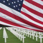 A United States flag is raised over the Normandy American Cemetery in Colleville-sur-Mer, Normandy, France. Photo submitted by Mac Macdonald