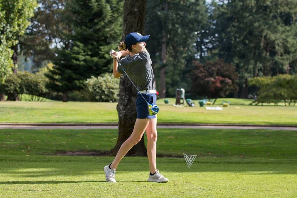 Sequim High 2017 graduate Alex McMenamin tees off for the George Fox Bruins. Photo courtesy of George Fox Sports Marketing