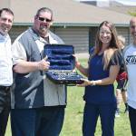 Former Sequim Middle School student Carly Swingle donates a clarinet to the SMS program. Pictured, from left, are Dr. Mathew Niemeyer at NW Eye Surgeons (Swingles employer), SMS band director George Rodes, Swingle and SMS principal Vince Riccobene. Submitted photo