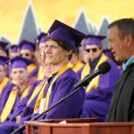 Sequim High principal Shawn Langston, right, lists some high praise from SHS teacher for senior Jacobb Denny, the schools first unanimous U-Turn award winner. Sequim Gazette photo by Michael Dashiell