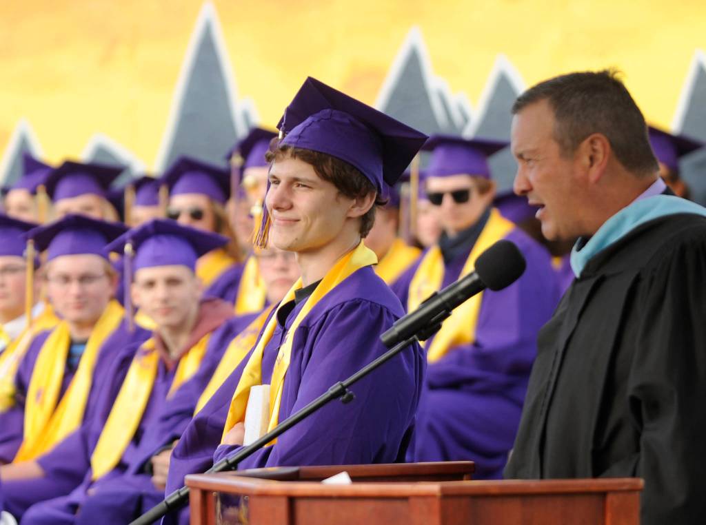 Sequim High principal Shawn Langston, right, lists some high praise from SHS teacher for senior Jacobb Denny, the schools first unanimous U-Turn award winner. Sequim Gazette photo by Michael Dashiell