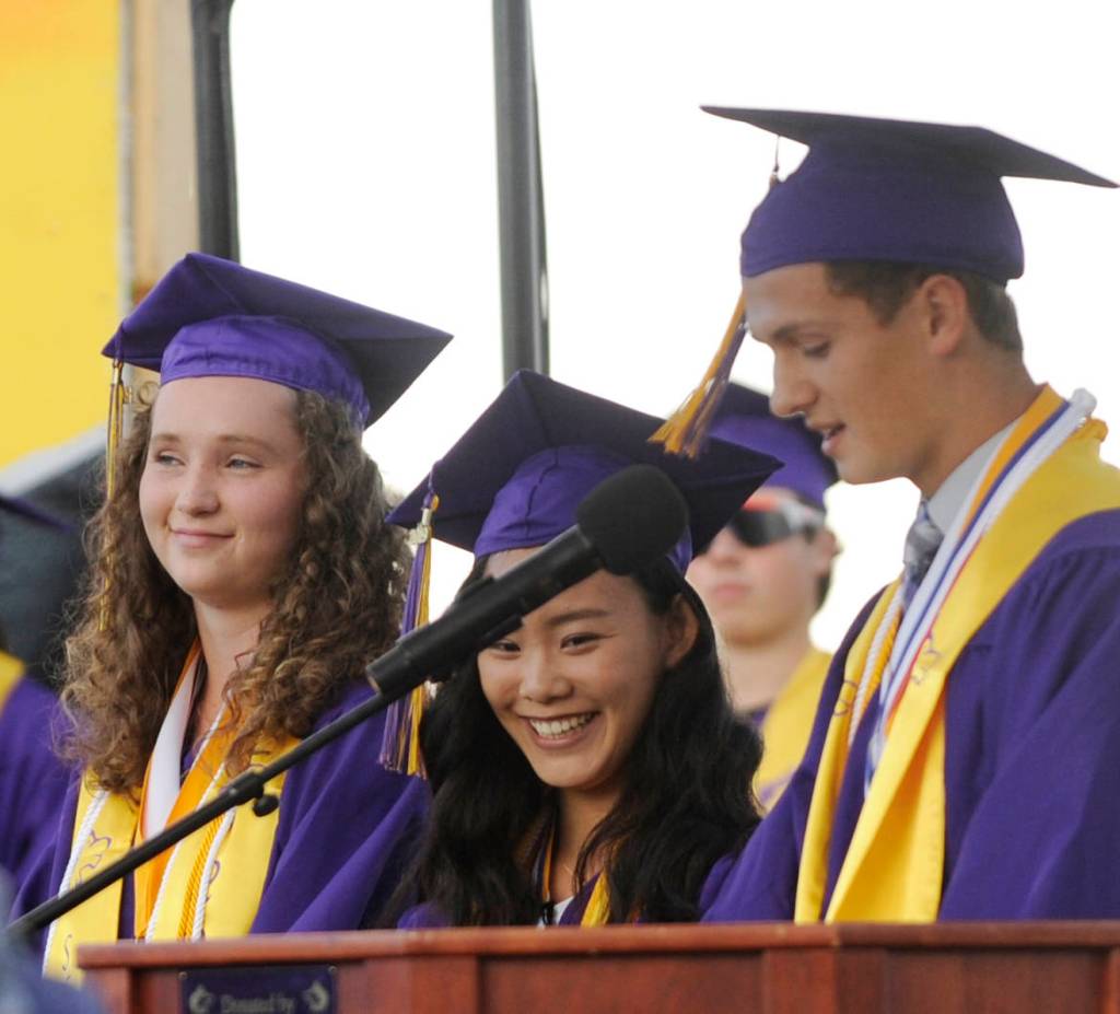 From left, Arlene Law and Elizabeth Sweet join Liam Payne  three of Sequim Highs seven valedictorians  in giving a group valedictory address at the SHS Class of 2019 graduation ceremony on June 7. Sequim Gazette photo by Michael Dashiell