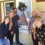The woodpecker climbs again: Representatives of the volunteer Capital Campaign Committee raising funds for the proposed Dungeness River Audubon Center expansion include, from left, Darcy McNamara, chair Annette Hanson, center director Powell Jones, Kendra Donelson, Wanda Schneider and Tuttie Peetz. Here they stand in front of the Inspire Wonder Capital Campaign banner  now at about 90 percent (as marked by the woodpecker) of the approximate $3.6 million goal after recently receiving word of a $1.5 grant through a State Capital Budget appropriation. Submitted photo