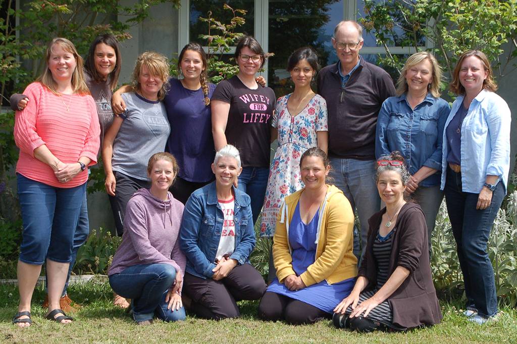 Members of the new Five Acre School non-profit board Susan Craig, far left, and Kristin Smith, far right, join school director Lauren Denton, second from left, and the rest of the Five Acre School staff at the school during a special staff lunch celebrating the end of the school year. Sequim Gazette photo by Conor Dowley