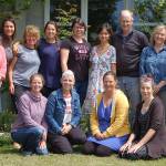 Members of the new Five Acre School non-profit board Susan Craig, far left, and Kristin Smith, far right, join school director Lauren Denton, second from left, and the rest of the Five Acre School staff at the school during a special staff lunch celebrating the end of the school year. Sequim Gazette photo by Conor Dowley
