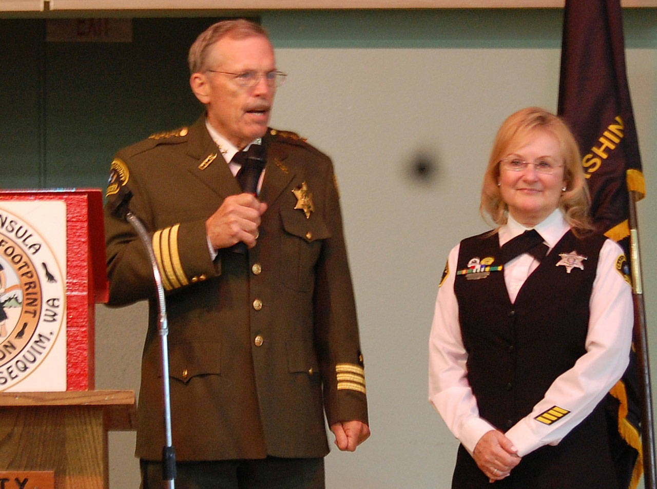 Clallam County Sheriff Bill Benedict congratulates Sylvia Orth, Footprinters of Olympic Peninsula Chapter 74s 2018 Officer of the Year. Submitted photo