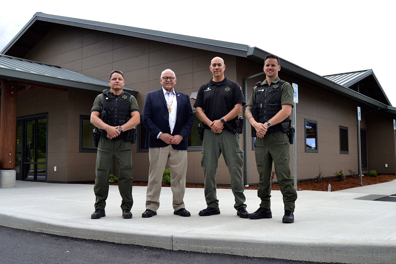 The new Public Safety and Justice Center for the Jamestown SKlallam Tribe offers bigger space for tribal officers Patrick Carter, left, Police Chief Rory Kallappa and Jason Robbins. Ron Allen, Jamestown tribal chairman and CEO, second from left, said when people come here whether for a case or any regard with a judicial or public safety matter, they know theyre walking into a place that reflects professionalism and integrity of a quality law enforcement system. Sequim Gazette photo by Matthew Nash