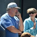 Stephen Rosales, board member for the Sequim Food Bank, learns theyve name the bread and meat building after him on June 15 as his wife Kim, right, and Deon Kapetan, left, congratulate him.