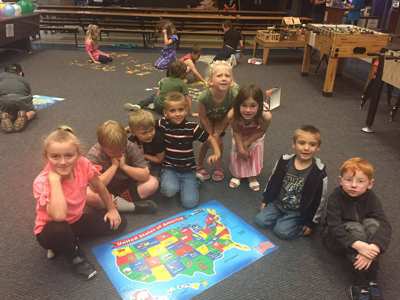 Youths at the Sequim Boys & Girls Club take a break from putting a floor puzzle together. Photo courtesy of Boys & Girls Clubs of the Olympic Peninsula