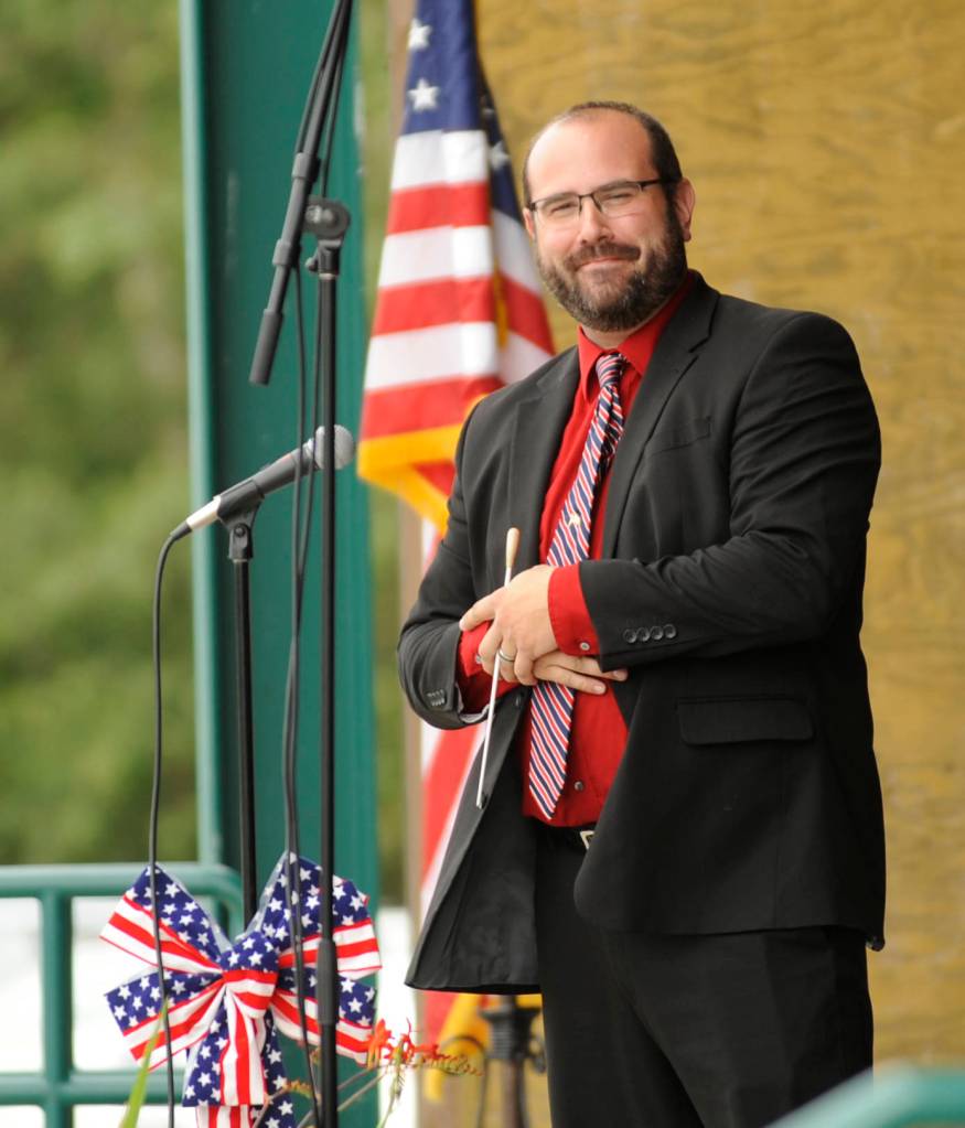 Sequim City Band director Tyler Benedict leads the band at Thursdays A Patriotic Fourth concert. Sequim Gazette photo by Michael Dashiell