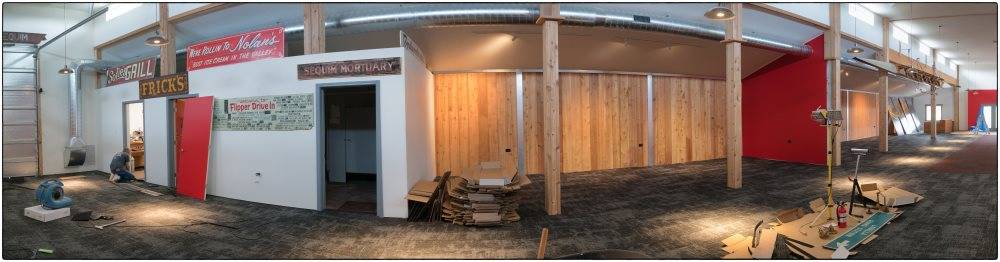 Inside the Sequim Museum & Arts facility on June 7, and a (below) month later, at the facilitys grand opening. Photo by Bob Lampert