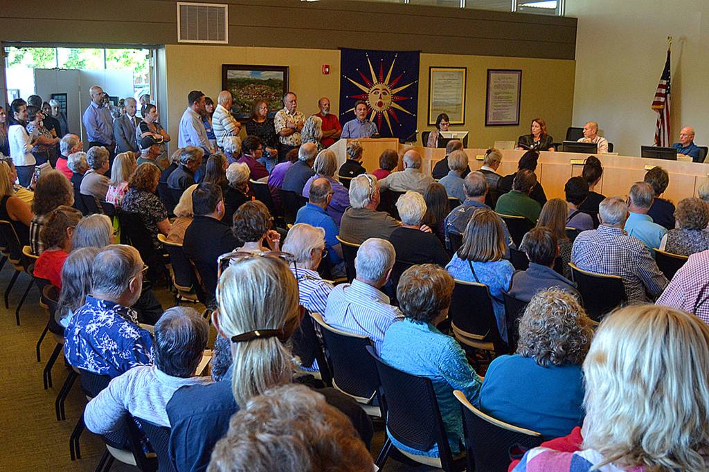 Barry Berezowsky, Sequim director of community development, addresses a crowd of more than 150 people on July 8 during a Sequim city council meeting, saying that theres no proposal before city staff about the much talked about medication-assisted addiction treatment (MAT) facility. He said if a proposal does come in, itll will go before the Planning Commission. Sequim Gazette photo by Matthew Nash