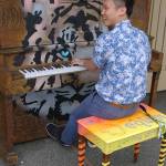 Anson Ka-lik Sin plays a Scarlatti sonata on the community piano placed in front of US Bank at the corner of Washington Street and Sequim Avenue. A Hong Kong native and former Peninsula College student, Sin still enjoys coming to Sequim to play and perform. Sequim Gazette photo by Conor Dowley.
