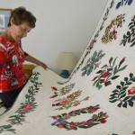 In Karen Clatanoffs guest room hangs Baltimore Album, a hand applique quilt that took her about a year to finish. It was the first blue ribbon she won with the Sunbonnet Sue Quilt Club, and will go on display again this weekend. Sequim Gazette photo by Matthew Nash