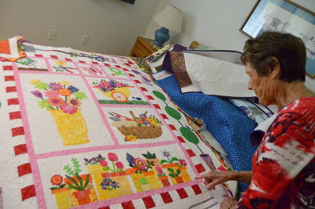 Themes for Karen Clatanoffs quilts range from dogs to fish to farms to gardens. Sequim Gazette photo by Matthew Nash