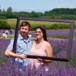 Michigan couple Nathan and Olivia Mckay setup a photo-op at Jardin du Soleil Lavender Farm last year. The farm continues to offer free photos as part of its Jardin du Soleil Lavender Festival July 19-21. Sequim Gazette file photo by Erin Hawkins.