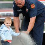 Library, firefighters help spray summer rain away at storytime