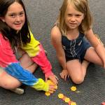 Left, Sydney Adkisson and Hayley Cavanaugh pose with a geometric pattern they were working on together as part of one of the Clubs educational activities last week. Right, William Cottington looks up from his watercolor painting in progress in the Boys & Girls Club in Sequim. Submitted photos