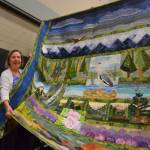 Harriet Freeman of Sequim bought a handful of raffle tickets and came away with the Sunbonnet Sue Quilt Clubs annual raffle quilt to benefit the clubs various community programs. Organizers said they sold at least $6,000 in tickets for Northwest Splendor. It took one-and-a-half years to make from the efforts by quilters Sue Nylander, Carolyn Abbott, Catherine Bilyard, Anne Davies, Sherry Nagel, Liisa Fagerland, Ilse Osier, Nancy Wilcox, Mary Ann Clayton, Janet Green, Carol Geer, and quilter by Brianne Moore. Sequim Gazette photo by Matthew Nash