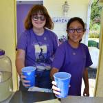 Tilly Lundstrom and Ali Edgecombe serve up lavender lemonade at Nelsons Duckpond & Lavender Farm with sales benefiting the Sequim Food Bank. Tilly, 14 now, has been donating her proceeds each Sequim Lavender Festival to various nonprofits in the community since she was 5. Sequim Gazette photo by Matthew Nash