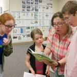 From left, Grayce Houle, Maia Brewer, director Bonne Smith and Hunter Halverson work on lines for the upcoming Olympic Theatre Arts production of The Reluctant Dragon. Photo courtesy of Olympic Theatre Arts