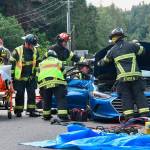 Firefighter/EMT personnel work to extricate two trapped occupants of a vehicle involved in a six-vehicle crash on the Elwha River Bridge on July 24. Photo courtesy of Clallam County Fire District No. 2