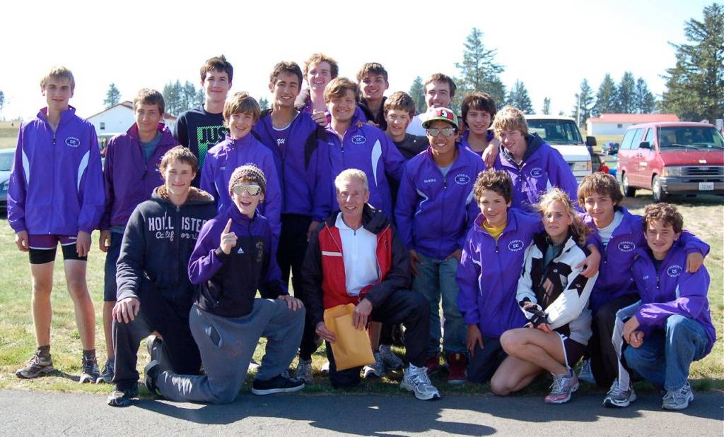 Sequim High coach Harold Huff (front row, center), pictured here following the Seaside Three-Course Classic in 2009, is calling it a coaching career after 18 years with the SHS cross country program. Huff said the Seaside, Ore., event was an athlete favorite each year. Submitted photo