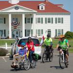 As part of a special Sequim Wheelers ride event at the Tour de Lavender, Vern Frykholm, left, is piloted by Lanie Cates as they ride away from the George Washington Inn on Aug. 3. The Sequim Wheelers are an organization that provides bicycle rides to the elderly and disabled who otherwise couldnt ride. Sequim Gazette photo by Conor Dowley
