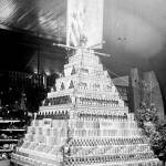A display of canned salmon looms large at the first Clallam County Fair, October 1895. Arranged by the National Packing Company, the pyramid of cans were arranged on top of boxes with labels reading American Flag Brand Salmon. Photo courtesy of Washington State Library