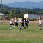 Storm King girls U9-U10 attackers (blue shirts) swarm the box on an early corner kick against Harbor Youth Soccer Club (white shirts) on Aug. 4. Storm King went on to win that match 3-1 to seal their division championship on points. Sequim Gazette photo by Conor Dowley.
