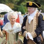 Vern Frykholm, right, walks across the 2018 Colonial Festival portraying George Washington alongside Jane Ritchey, left, portraying Martha Washington. Sequim Gazette file photo by Michael Dashiell