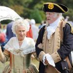 Vern Frykholm, right, walks across the 2018 Colonial Festival portraying George Washington alongside Jane Ritchey, left, portraying Martha Washington. Sequim Gazette file photo by Michael Dashiell