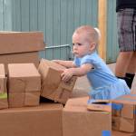 Mia Smith, 18 months, dressed as Cinderella looks to build a castle during Princess Storytime at the Sequim Librarys Summer Reading Program. Sequim Gazette photo by Matthew Nash