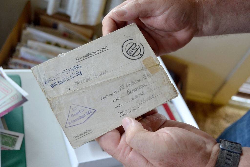 In the last five years, Phil Castell has collected items with stamps or cancellations to his hometown of Blackpool, England, including this World War II Prisoner of War letter from Germany to Blackpool. Sequim Gazette photo by Matthew Nash