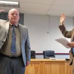 Rob Clark is officially sworn in as the interim superintendent of the Sequim School District by Judge Brian Coughenour at the Aug. 5 school board meeting. Sequim Gazette photo by Conor Dowley.