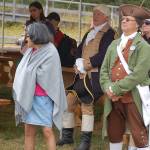 Vern Frykholm (portraying George Washington), center, listens as narrator Jeff Dacus, out of frame, describes the events leading up to the Battles of Lexington and Concord. Sequim Gazette photo by Conor Dowley