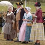 Vern Frykholm (portraying George Washington), second from left, stands alongside Jane Ritchey (Martha Washington), Laury Long (Esther Reed) and Lucy Keegan (Eliza Pinckney) as they observe the reenactment.