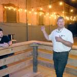 Lincoln Theater co-owner Marty Marchant, right, speaks about an agreement to provide a permanent home for Ghost Light Productions as Ghost Light founder Mark Lorentzen, left, listens. (Keith Thorpe/Peninsula Daily News)