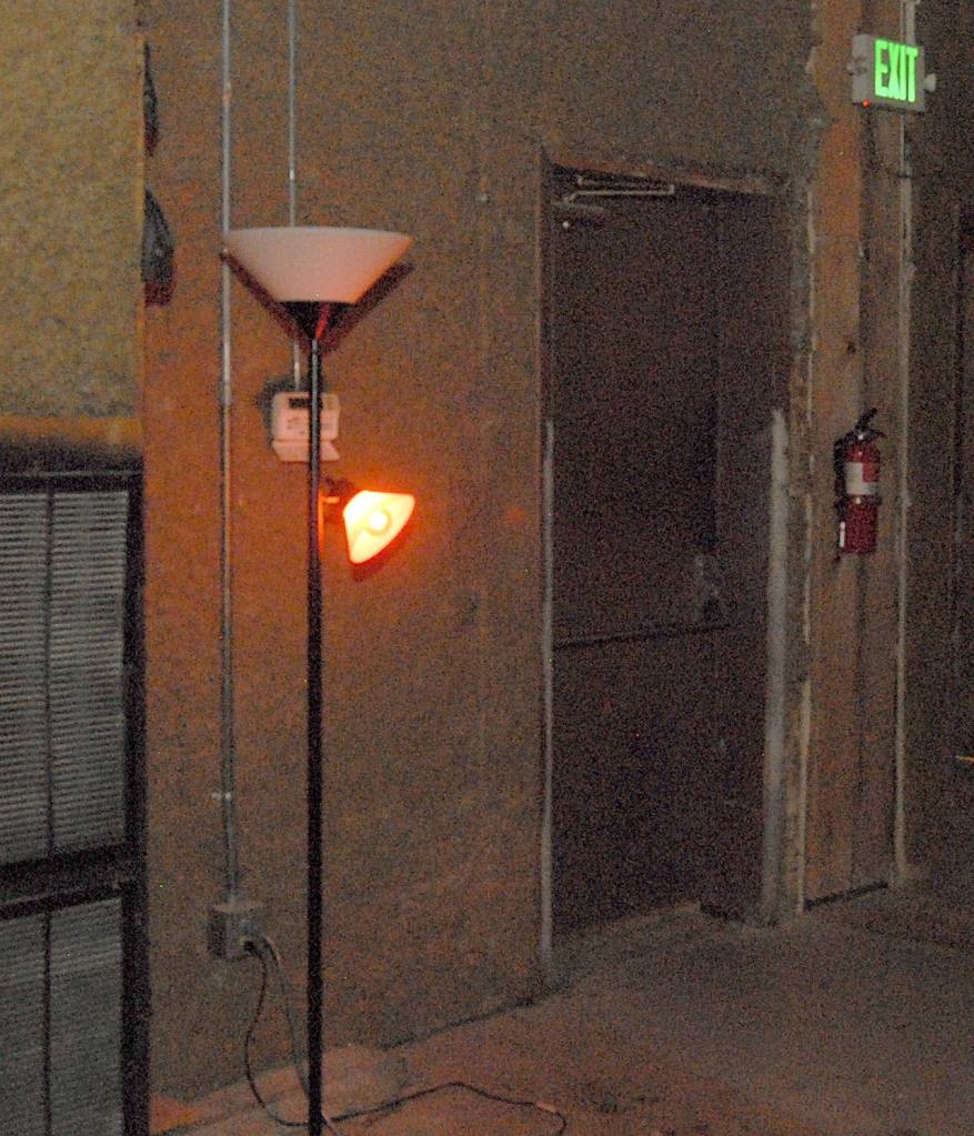 An illuminated ghost light stands near the backstage area at the Lincoln Theater. (Keith Thorpe/Peninsula Daily News)