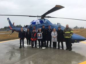 Community members and dignitaries stand with Eagle Scout candidate Ben Wright, left, during Diamond Point Airports Airport Appreciation event on Aug. 10 that celebrated the completion of a new helipad. Photo courtesy of Kaye Gagnon