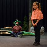 Fred the Dragon (Grayce Houle) prefers yoga over controversy as Charity (Maia Brewer) tries to convince him that the towns people might hurt him in The Reluctant Dragon. Sequim Gazette photo by Matthew Nash