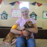Zoie Davis, 14, of Forks, holds her dachshund Dixie at the Clallam County Fair last week. Davis is part of the Happy Tails 4-H Club. Sequim Gazette photo by Michael Dashiell