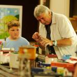 Nathaniel Baze, 7, at left, talks with Steve Dryke of the North Olympic Railroaders group at the Clallam County Fair last week. Sequim Gazette photo by Michael Dashiell